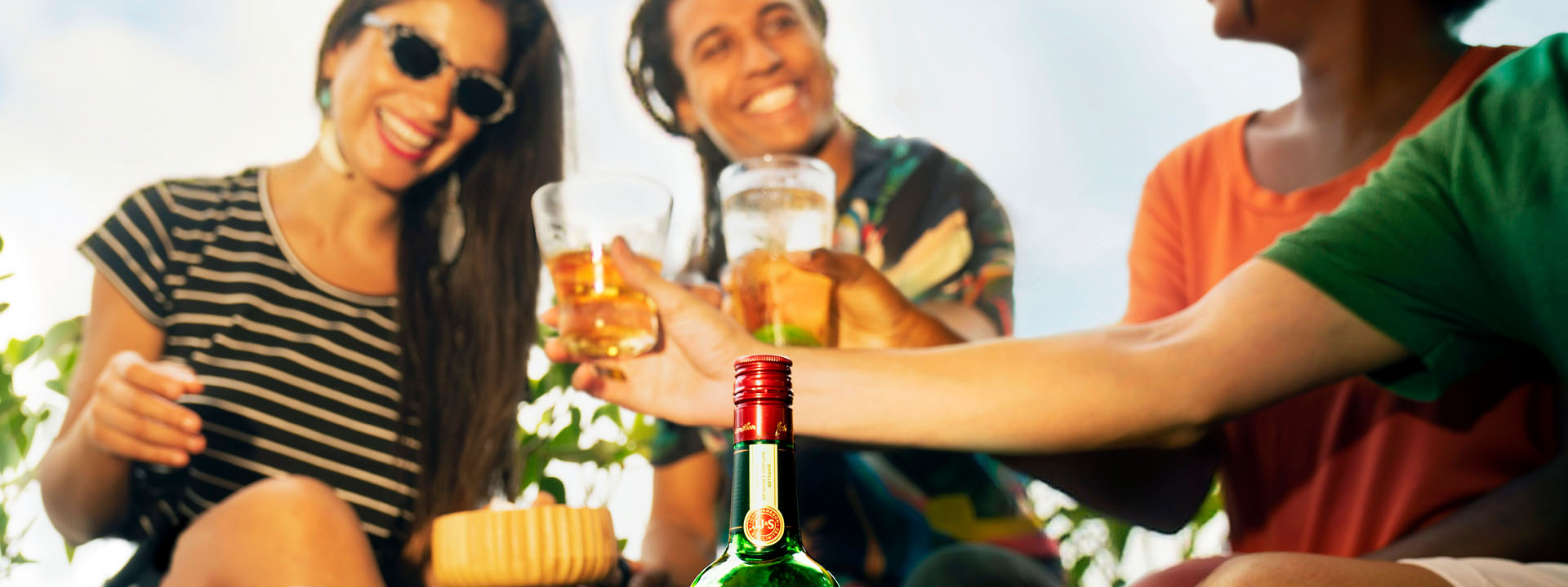 Friends raising a toast to St. Patrick's Day with Jameson Irish whiskey