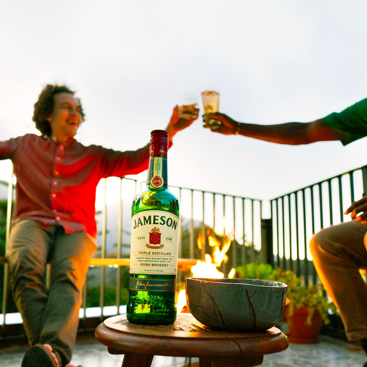 Friends giving a cheers with Jameson Irish Whiskey
