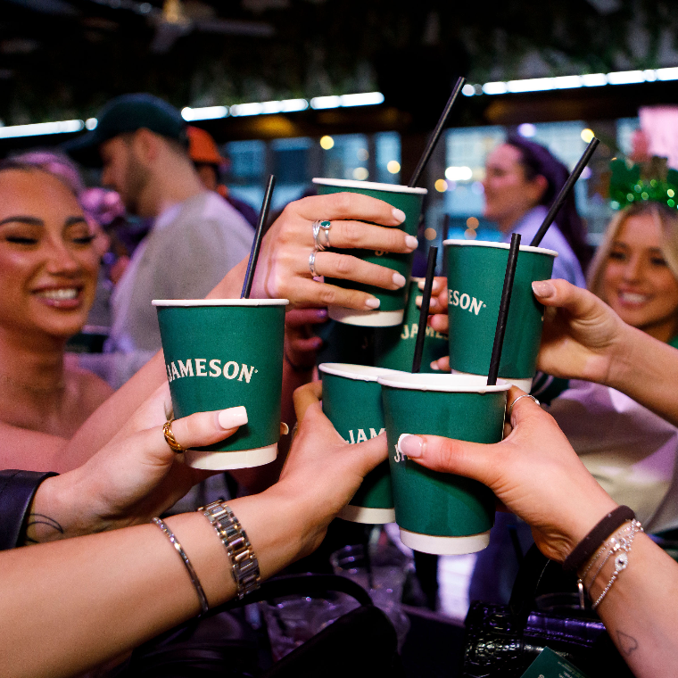 girls celebrating st patrick's day with jameson ginger ale and lime