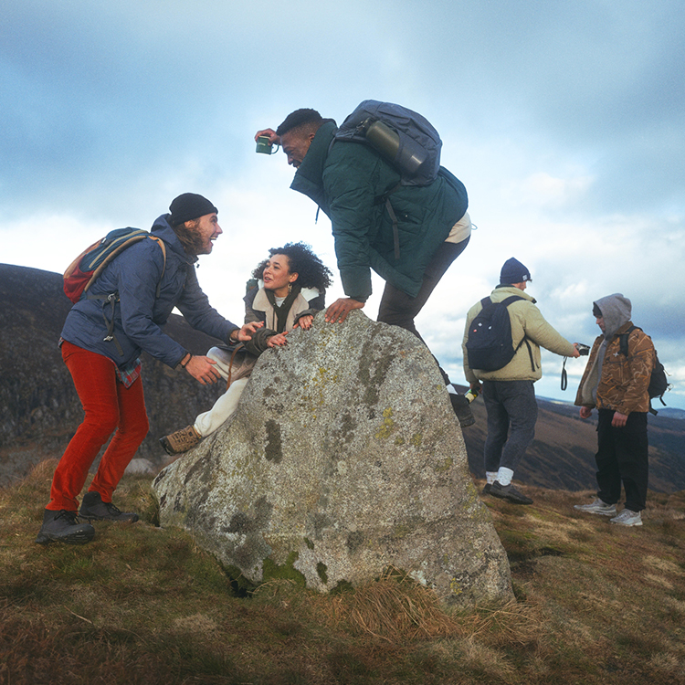 a group of explorers climbing an Irish mountain