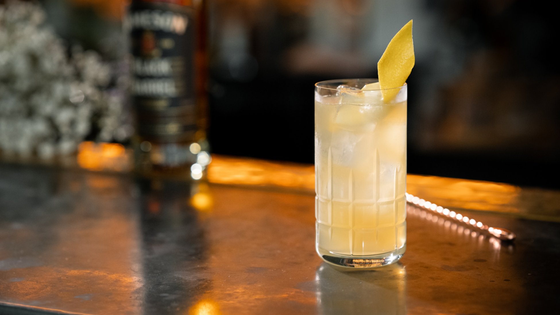 irish lemonade cocktail with a lemon spiral garnish